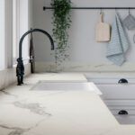 Caesarstone 503 Circa Porcelain kitchen with sink and golden tap.