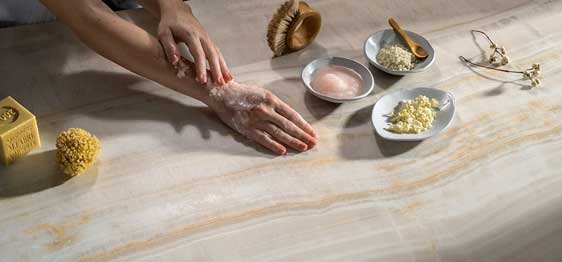Caesarstone Porcelain 509 Onyxa surface with hand and soaps
